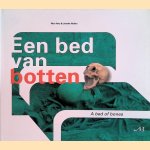 Een bed van botten. Het archeologisch onderzoek van de middeleeuwse Catharinakerk te Eindhoven in beeld / A bed of bones. The archeological investigation of the medieval Church of St. Catharine in Eindhoven - a story in pictures door Nico Arts e.a.